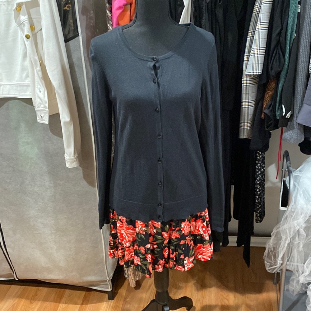 Black cardigan, sweater fully buttoned
